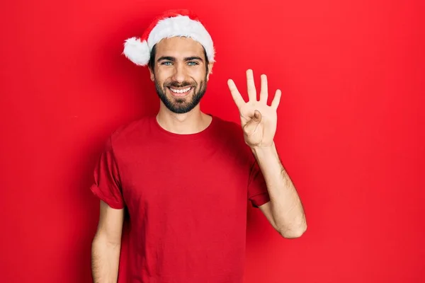 Jeune Homme Hispanique Portant Chapeau Noël Montrant Pointant Vers Haut — Photo