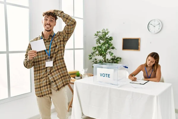 Young Handsome Man Voting Putting Envelop Ballot Box Stressed Frustrated — Fotografia de Stock