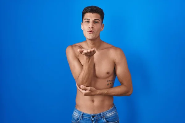 Young Hispanic Man Standing Shirtless Blue Background Looking Camera Blowing — Stock Photo, Image