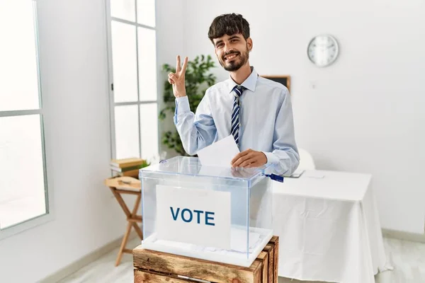 Hispanic Man Beard Voting Putting Envelop Ballot Box Smiling Looking — Fotografia de Stock