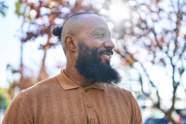 Young african american man smiling confident standing at park