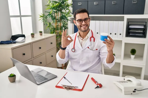 Young Hispanic Doctor Man Beard Holding Ear Cotton Buds Doing — Stock Photo, Image