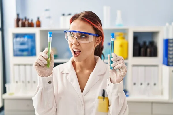 Young Caucasian Woman Working Scientist Laboratory Holding Samples Angry Mad — 스톡 사진