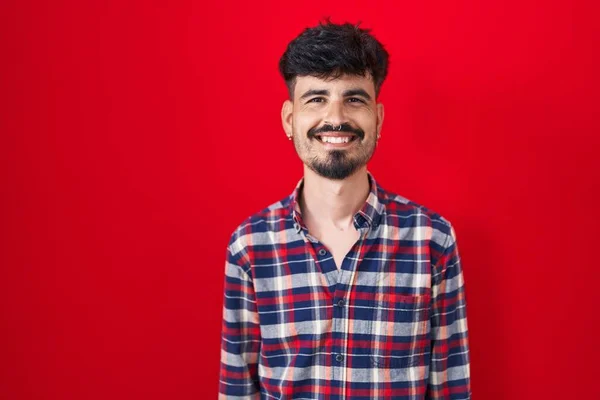 Young Hispanic Man Beard Standing Red Background Happy Cool Smile — Stock Fotó