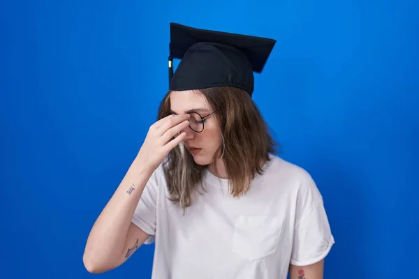 Blonde Caucasian Woman Wearing Graduation Cap Tired Rubbing Nose Eyes — Stockfoto