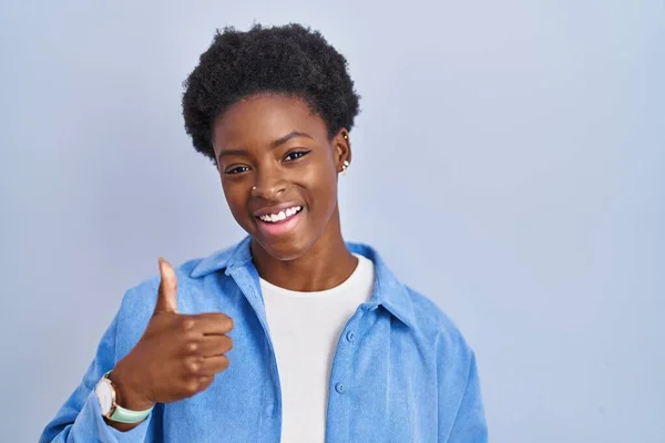 African American Woman Standing Blue Background Doing Happy Thumbs Gesture — Photo