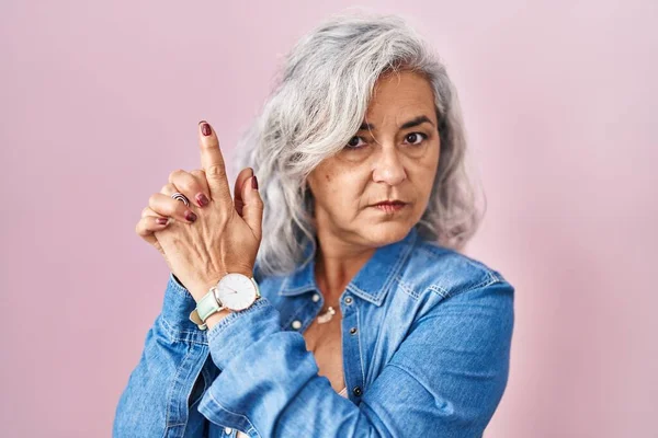 Middle Age Woman Grey Hair Standing Pink Background Holding Symbolic — Fotografia de Stock