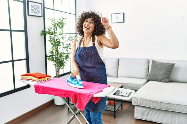 Young Middle Eastern Woman Ironing Clothes Home Smiling Amazed Surprised — 스톡 사진