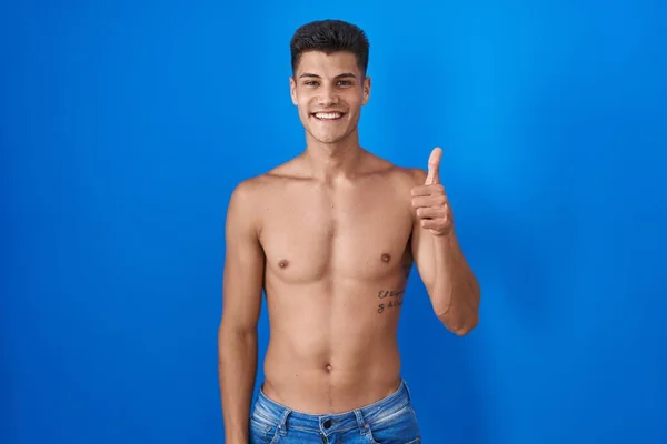 Young Hispanic Man Standing Shirtless Blue Background Doing Happy Thumbs — Foto Stock