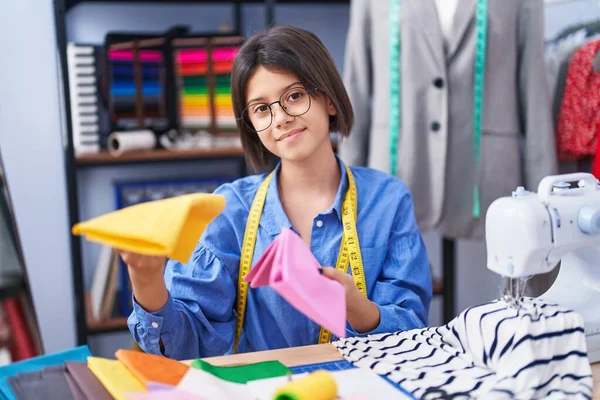 Adorable Hispanic Girl Tailor Smiling Confident Holding Cloths Clothing Factory — ストック写真