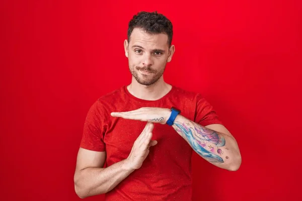 Young Hispanic Man Standing Red Background Doing Time Out Gesture — Stock Photo, Image
