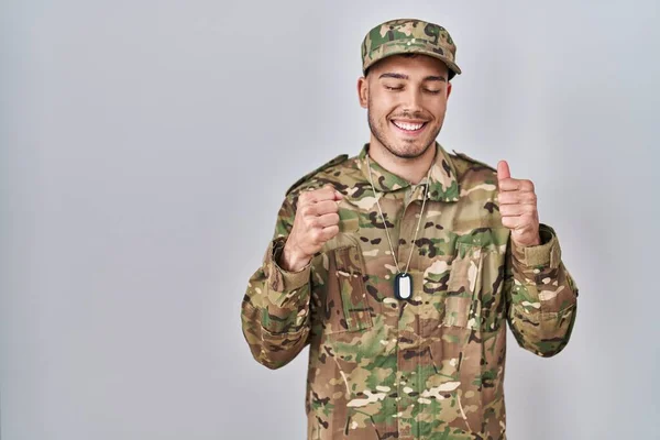 Young Hispanic Man Wearing Camouflage Army Uniform Excited Success Arms — Stock Photo, Image