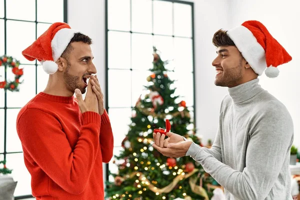 Two Hispanic Men Couple Surprise Engagement Ring Standing Christmas Tree — Stock Photo, Image