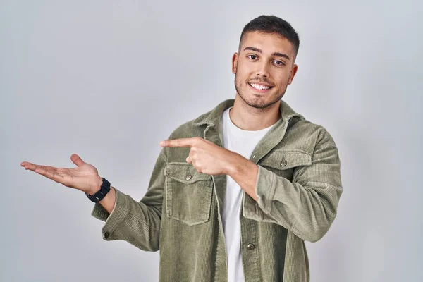 Young Hispanic Man Standing Isolated Background Amazed Smiling Camera While — Stockfoto