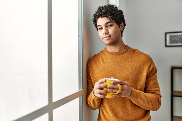 Young Hispanic Man Drinking Coffee Standing Home — Foto de Stock