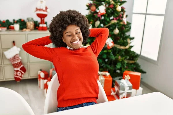 Young African American Woman Relaxed Hands Head Sitting Christmas Tree — ストック写真