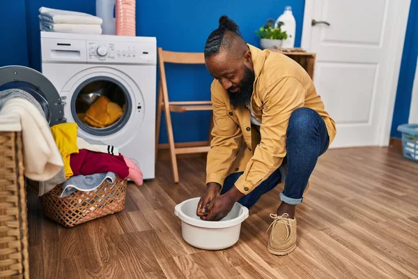 Young African American Man Cleaning Cloth Cube Water Laundry Room — Stok fotoğraf