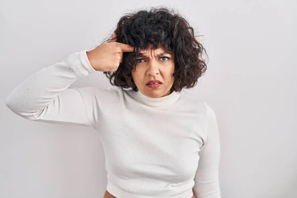 Hispanic Woman Curly Hair Standing Isolated Background Pointing Unhappy Pimple — Stock Photo, Image