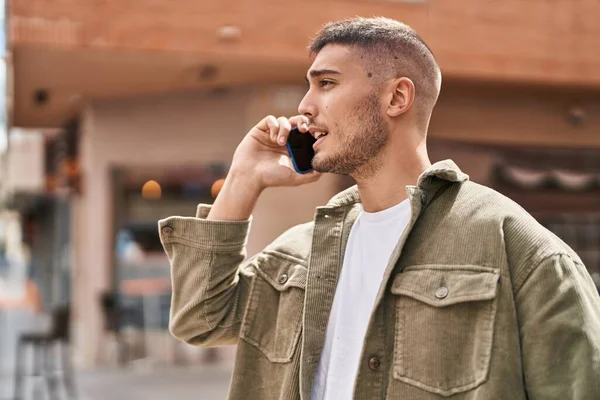 Young Hispanic Man Talking Smartphone Street — стоковое фото