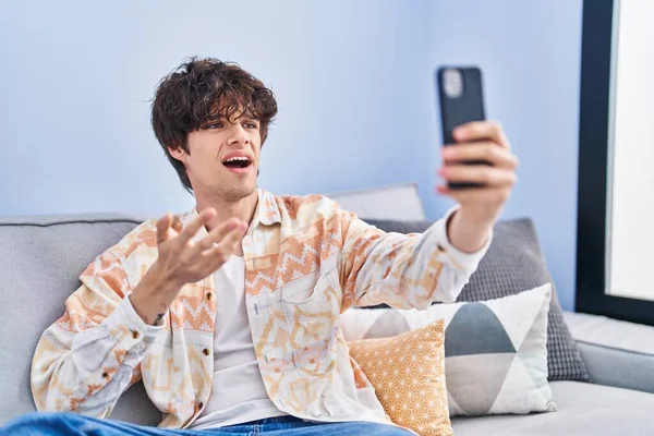 Young Hispanic Man Having Video Call Sitting Sofa Home — Stock Photo, Image