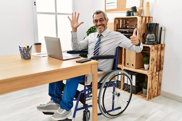 Middle Age Hispanic Man Working Office Sitting Wheelchair Showing Pointing — Stock Photo, Image