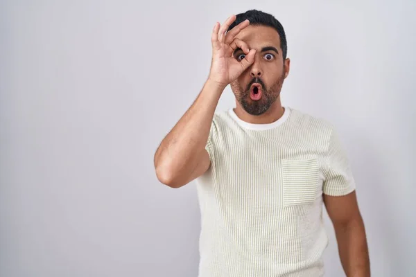 Hispanic Man Beard Standing Isolated Background Doing Gesture Shocked Surprised — Stok fotoğraf