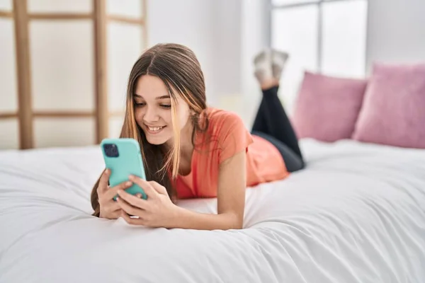 Adorable Girl Using Smartphone Lying Bed Bedroom — Zdjęcie stockowe