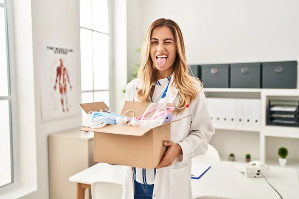 Young Blonde Doctor Woman Holding Box Medical Safety Items Sticking — Stock Photo, Image
