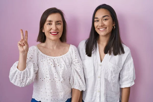 Hispanic Mother Daughter Together Showing Pointing Fingers Number Two While — Stock Photo, Image