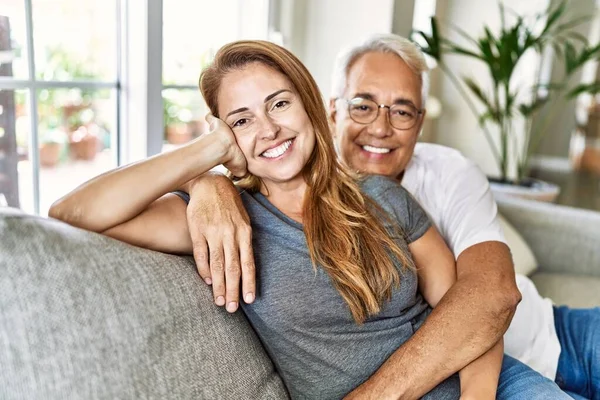 Middle Age Hispanic Couple Smiling Happy Hugging Sitting Sofa Home — Stock Photo, Image