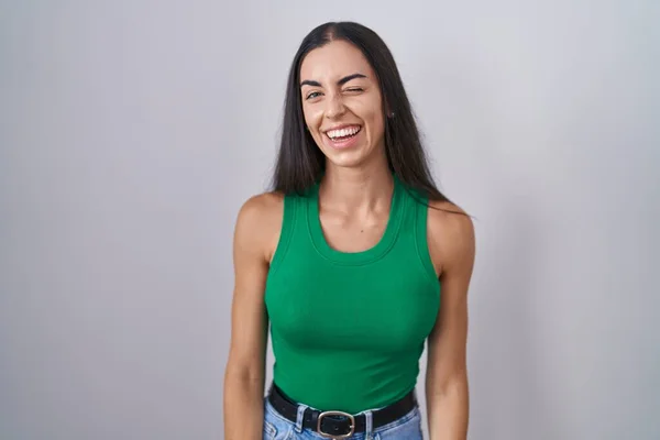 Young Woman Standing Isolated Background Winking Looking Camera Sexy Expression — Foto Stock