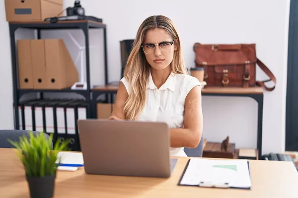 Young Blonde Woman Working Office Wearing Glasses Skeptic Nervous Disapproving — Stock Photo, Image