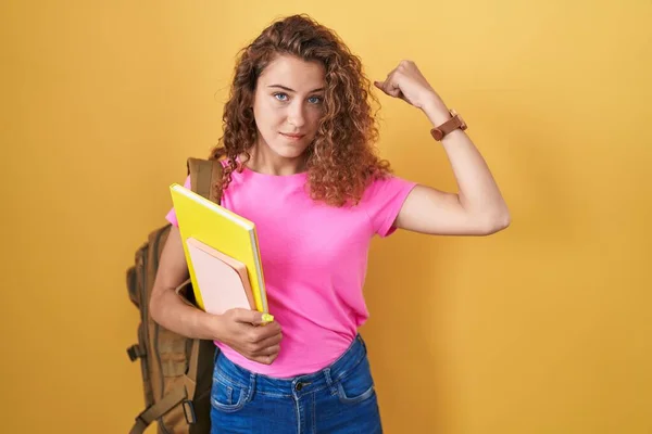Young Caucasian Woman Wearing Student Backpack Holding Books Strong Person — Stock Photo, Image