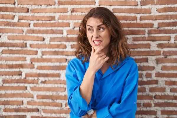 Beautiful Brunette Woman Standing Bricks Wall Thinking Worried Question Concerned — Stock Photo, Image