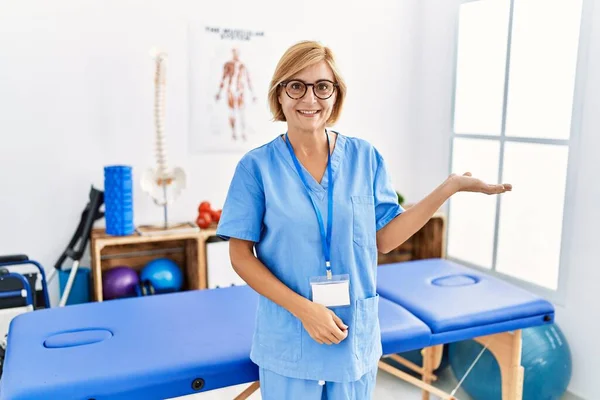 Middle Age Blonde Woman Working Pain Recovery Clinic Smiling Cheerful — Stock Photo, Image