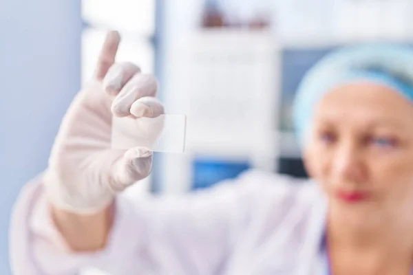 Middle Age Blonde Woman Wearing Scientist Uniform Holding Sample Laboratory —  Fotos de Stock