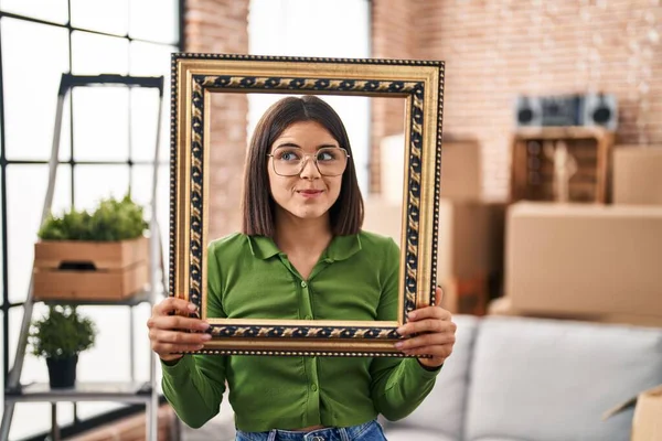 Young Hispanic Woman New Home Holding Empty Frame Smiling Looking — Stock Photo, Image
