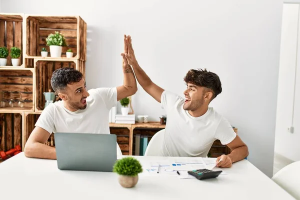 Two Hispanic Men Couple High Five Hands Raised Using Laptop — Stock Photo, Image