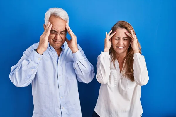 Middle Age Hispanic Couple Standing Blue Background Hand Head Headache — Stock Photo, Image