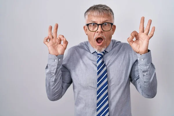 Hispanic Business Man Grey Hair Wearing Glasses Looking Surprised Shocked — Stock Photo, Image