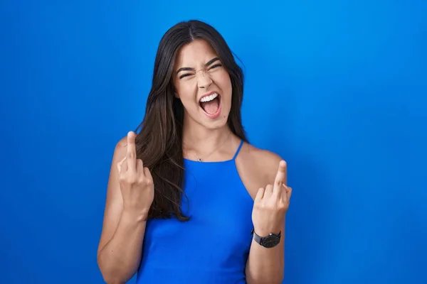 Hispanic Woman Standing Blue Background Showing Middle Finger Doing Fuck — Stockfoto