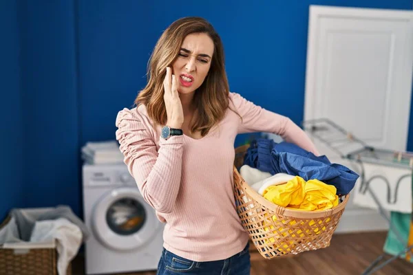 Young Woman Holding Laundry Basket Touching Mouth Hand Painful Expression — Stock Photo, Image