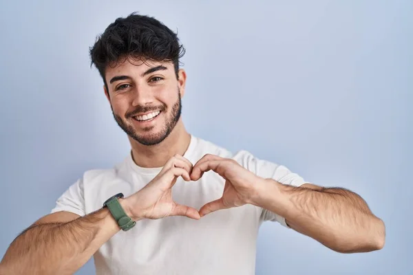 Hispanic Man Beard Standing White Background Smiling Love Doing Heart — Stock Photo, Image