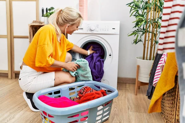 Young Blonde Girl Doing Laundry Putting Clothes Washing Machine Home — Stock Photo, Image