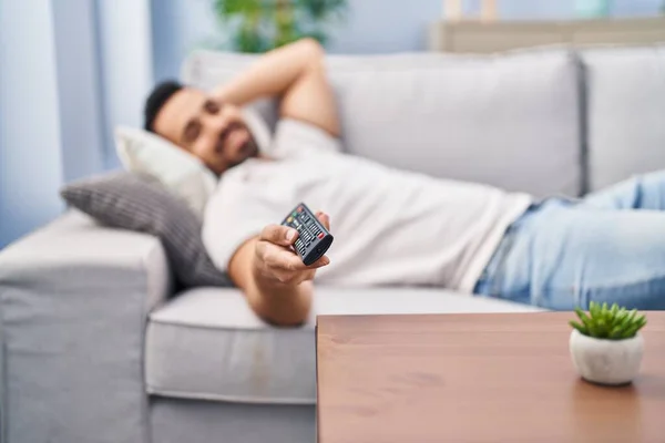 Young Hispanic Man Lying Sofa Watching Movie Home — Foto Stock