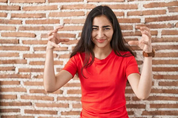 Young Teenager Girl Standing Bricks Wall Shouting Frustrated Rage Hands — Stockfoto
