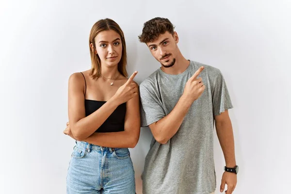 Young Beautiful Couple Standing Together Isolated Background Pointing Hand Finger — Stock Photo, Image