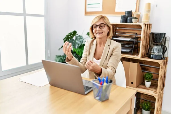 Middle Age Blonde Woman Smiling Confident Having Video Call Office — Fotografia de Stock