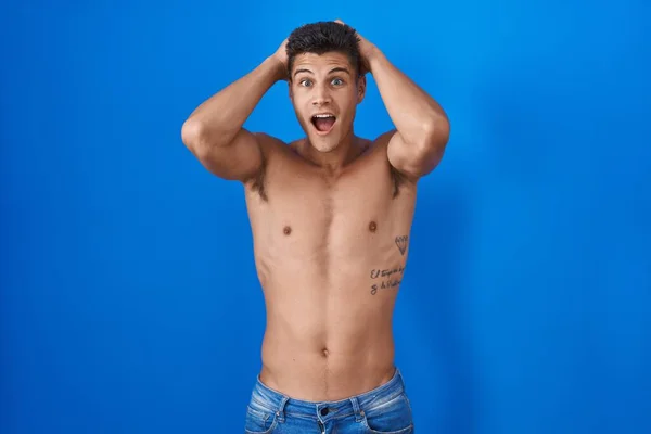 Young Hispanic Man Standing Shirtless Blue Background Crazy Scared Hands — Stock Photo, Image