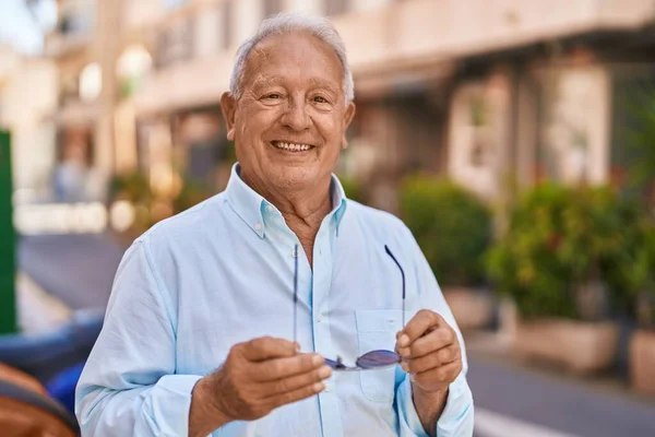 Senior Grey Haired Man Smiling Confident Holding Sunglasses Street — Stock Photo, Image
